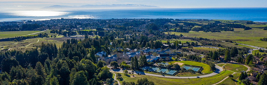 Aerial view of UCSC campus overlooking the Pacific Ocean and Monterey Bay