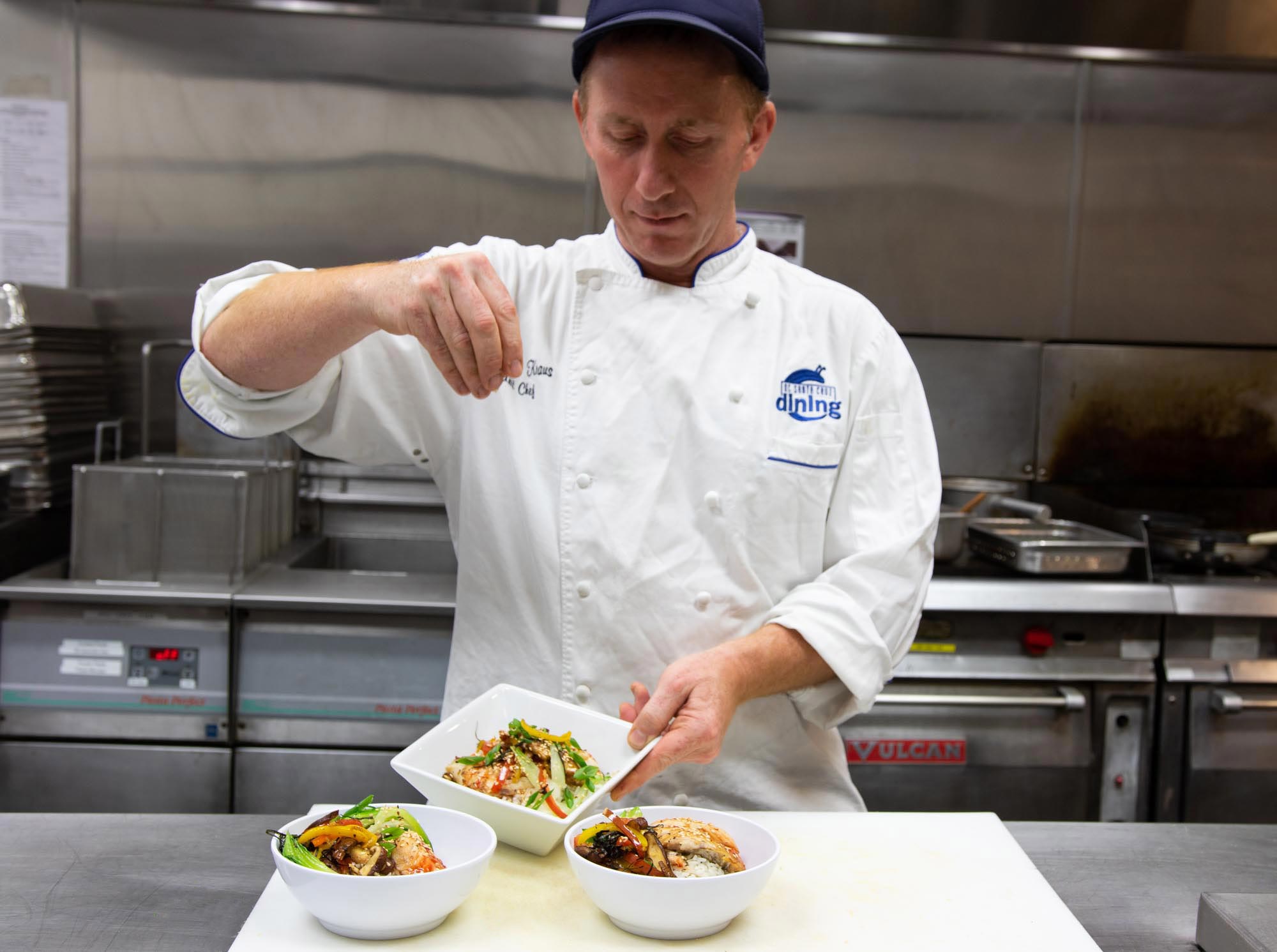 UCSC Dining chef adds the finishing touch on a dish